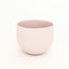 Pink porcelain coffee cup on a white background. Handmade in Berlin.