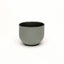 Sage green olive porcelain coffee cup on a white background. Handmade in Berlin.